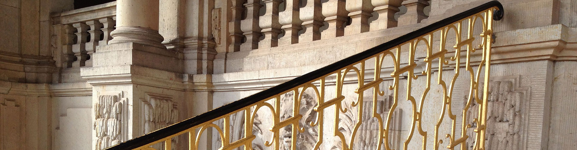 A golden-painted banister at the Dresden Opera House.
